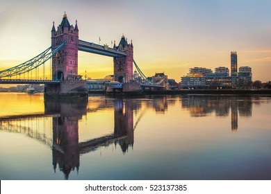 London Tower Bridge And Thames River Viewed At Sunrise In London, England.