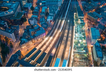 London. Train Station And Tower Bridge Night Lights, Aerial View.