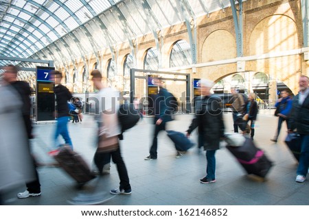 London Train Tube station Blur people movement in rush hour 