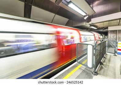 London tube arriving in a station.