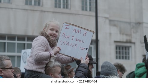 London, UK - 01 22 2022: A Young Child Holding A Sign Amongst A Crowd Of Protesters, ‘I Am 8 But I Will Stand Up!’, A NHS Health Worker, At Portland Place For The ‘World Wide Rally For Freedom’.