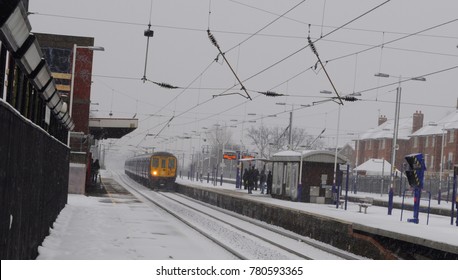 London / UK - 01/20/13: British Rail Class 319 Entering Mill Hill Broadway Station.