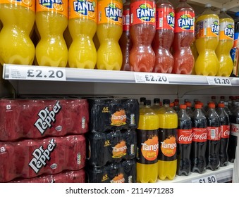 London. UK- 01.26.2022. Popular Brands Of High Sugar Content, High Calories Unhealthy Soft Drinks On A Supermarket Shelf.