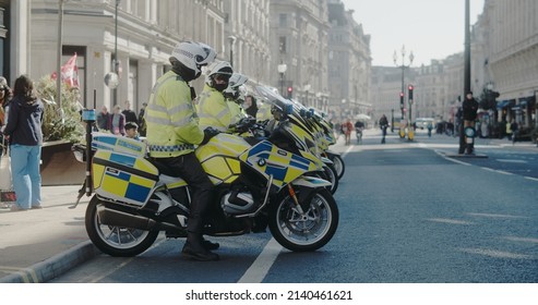 London, UK - 03 19 2022: A Line Up Of Met Police Officers On Motorbikes, On Regent Street, For The Yearly ‘March Against Racism’, Held Around The ‘UN Anti Racism Day’.