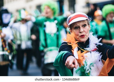 London / UK - 03/17/2019: Older Lady Dancing And Singing At St Patrick's Day Parade