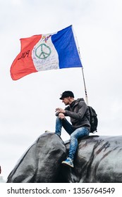 London / UK - 03/23/2019: Man With A French Flag Sitting On The Monument At Brexit March