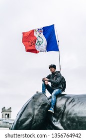 London / UK - 03/23/2019: Man With A French Flag Sitting On The Monument At Brexit March