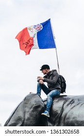 London / UK - 03/23/2019: Man Sitting On The Monument With French Flag At Brexit March