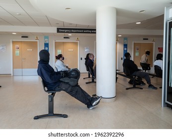 London. UK- 04.23.2021: People Admitted Into The Accident And Emergency Department Of A NHS General Hospital Waiting For Their Treatment In The Waiting Area.