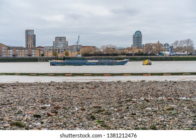 London, UK - 05, March 2019: The Port of London Authority barge used for transportation of bulk materials and waste for recycling and reprocessing.