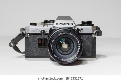 London, Uk 05/05/2018 A Retro Vintage Olympus Om 10 35mm Single Lens Reflex Film Camera And Lenses. Vintage Hipster Camera Making A Fashionable Come Back In Youth Culture.