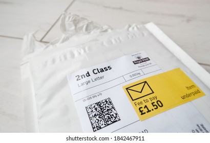 London, Uk, 05/05/20202 A Royal Mail Underpaid Item Fee Return Request On A Second Class Posted Large Letter. Pre Paid Post Returns Lost In The Post. Return To Sender White Envelope.