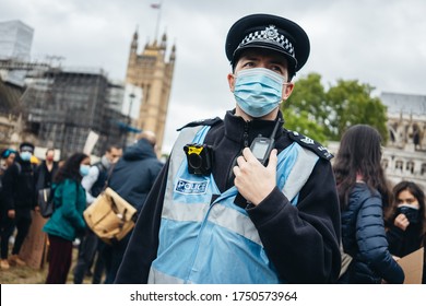 London / UK - 06/06/2020: Black Lives Matter Protest During Lockdown Coronavirus Pandemic. Police Officer Wearing A Mask