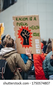 London / UK - 06/06/2020: Black Lives Matter Protest During Lockdown Coronavirus Pandemic. Racism Is Public Health Issue Sign