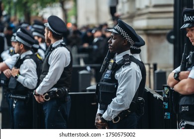 London / UK - 06/06/2020: Black Lives Matter Protest During Lockdown Coronavirus Pandemic. African American Police Officer At Downing Street