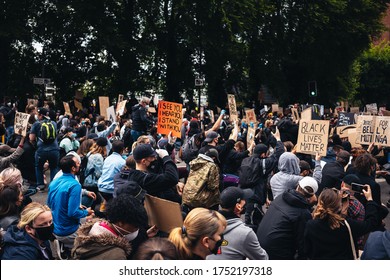 London / UK - 06/07/2020: Black Lives Matter Protest During Lockdown Coronavirus Pandemic. Protesters Kneeling At US Embassy