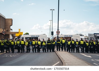 London / UK - 06/13/2020: Black Lives Matter Protest During Lockdown Coronavirus Pandemic. Police Oofficers Holding The Line At Waterloo Bridge