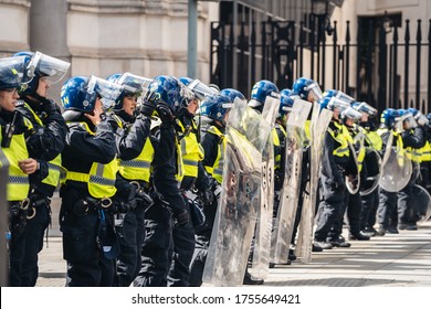 London / UK - 06/13/2020: Black Lives Matter Protest During Lockdown Coronavirus Pandemic. Police Officers Holding The Line, Protecting The Trafalgar Sqare From Protesters