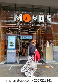 London. UK- 06.19.2022. Momo's, A High Street Restaurant Offering Japanese And Korean Fast Food.