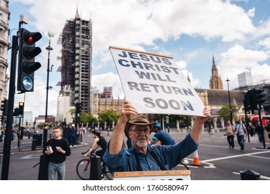 London / UK - 06/20/2020: Street Preacher Outside The British Parliament Stating Jeus Christ Will Return Soon During The Black Lives Matters Protest At Parliament Square