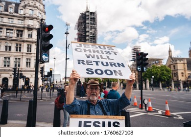 London / UK - 06/20/2020: Street Preacher Outside The British Parliament Stating Jeus Christ Will Return Soon During The Black Lives Matters Protest At Parliament Square