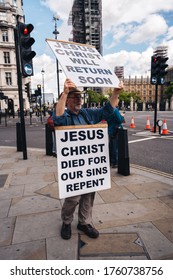 London / UK - 06/20/2020: Street Preacher Outside The British Parliament Stating Jeus Christ Will Return Soon During The Black Lives Matters Protest At Parliament Square