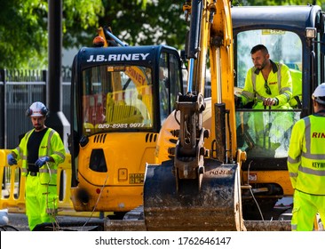 London. UK- 06.23.2020: A Construction Crew Working For The Company Riney Using Machinery Working In A Road Improvement Project In The East End Of London.