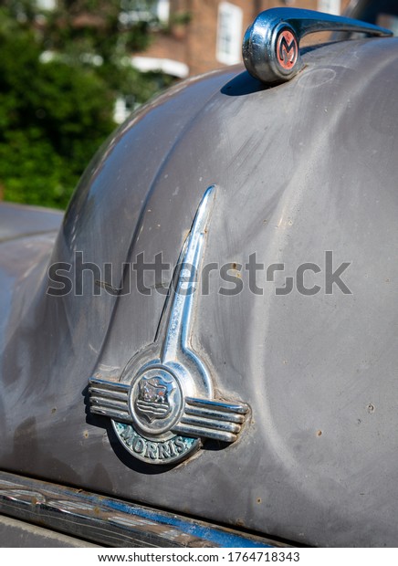 London. UK- 06.25.2020: the name badge of a Morris\
Minor, considered a British classic automotive design of\
Englishness. 