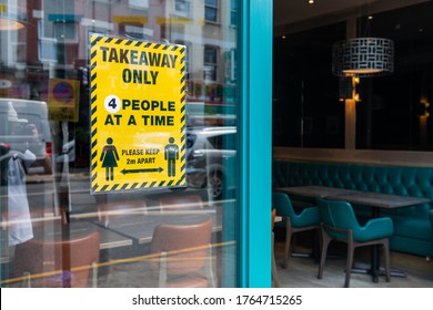 London. UK- 06.26.2020: A Social Distancing Customer Notice For Retailers In The Window Of A Restaurant As Required Under Covid 19 Pandemic Restrictions. 