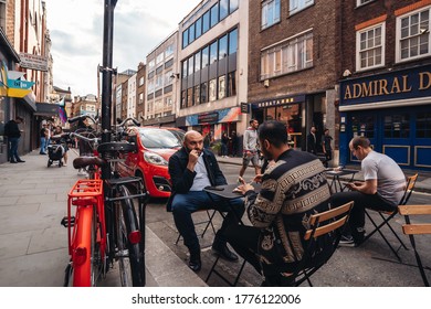 London / UK - 07/11/2020: People Sitting On The Busy Restaurant Terrace In Soho Area During Coronavirus Lockdown Ease