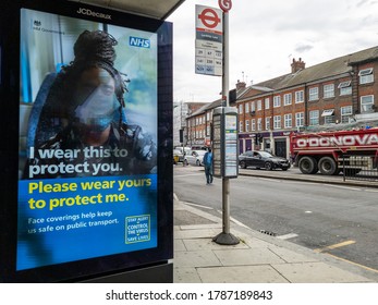 London. UK- 07.29.2020: Billboard By A Bus Stop With Advertisements From The NHS To Encourage People To Wear Mask To Protect Themselves And Other People.