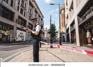 London / UK - 08/09/2020: Police Officers Securing The Perimeter After Stabbing In Oxford Street