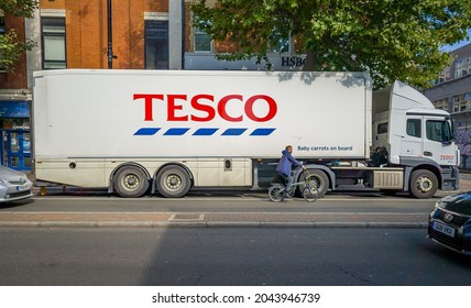 London. UK- 09.18.2021: a logistic truck of Tesco supermarket on the road making delivery to its stores amid driver shortage and supply chain problems in the country.