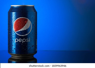 London, UK - 10.24.2020 Cold Pepsi can on blue background with copy space