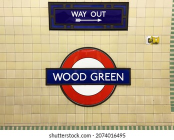 London UK - 11th November 2021 - Wood Green Underground Sign On Yellowed Tube Tiles On The Station Platform