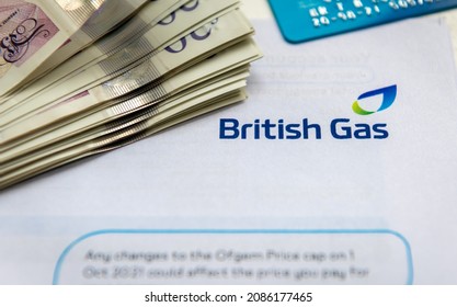 London. UK- 12.05.2021. A Close Up Of A British Gas Bill With A Pile Of Money And Payment Card. Raising Cost Of Energy Supplies.