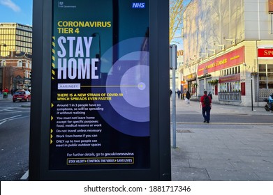 London. UK- 12.24.2020: Government Billboard Advertisement On The High Street Notifying People To Stay At Home Under Covid Tier 4 Restrictions.