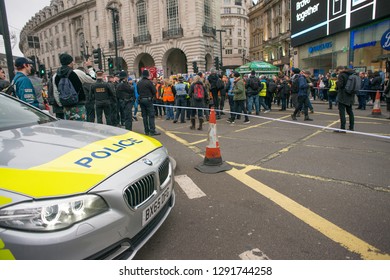 London, UK. 12th January 2019. Police Patrol Car Creates A Roadblock In Piccadilly Circus, London, To Stop All Traffic Ahead Of A Nearby Street Demonstration, To Ensure Public Safety At All Times.