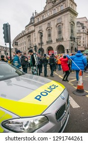 London, UK. 12th January 2019. Police Patrol Car Creates A Roadblock In Piccadilly Circus, London, To Stop All Traffic Ahead Of A Nearby Street Demonstration, To Ensure Public Safety At All Times.