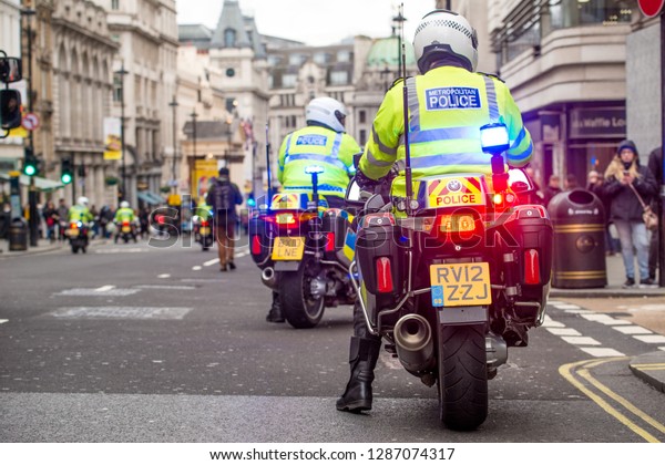 London, UK. 12th January 2019. Police motorcycle\
riders, escort and clear the roads ahead of any traffic for a\
planned street demonstration which is following close behind,\
through central London,\
UK.
