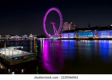 London  UK -  14042022: London Eye, Night, Colorful, Busy Area, Popular Tourist Destination, No People, Tourism, Back To Normal Life After COVID-19 Pandemic Restrictions