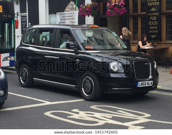 London, UK - 14/6/2019 : New Electric hybrid  black\
taxi in London. from Jan 2019 all black taxi bought new must be low\
emission - stock photo