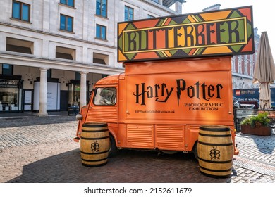 London, UK - 16 April 2022: Orange food and drink truck selling Butterbeer, in Covent Garden, London. This drink was make famous and popular by the Harry Potter film franchise. 