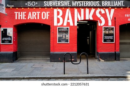 London, UK - 16 April 2022: The Exterior Of The Art Of Banksy Exhibition, In Covent Garden. Bansky Is An Anonymous British Graffiti Artist Known For His Anti Authoritarian Art And Political Activism.