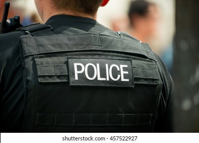 London, UK. 16th July 2016. EDITORIAL - Police Logo Patch, Being Worn On The Rear Of A Bullet Proof Vest, By A Police Officer In Central London, UK.