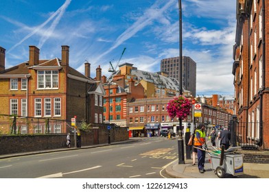 London, UK 17.08.2012: Street Cleaner On The Street Of The Old English City