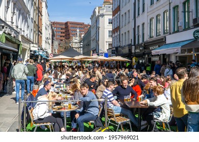 London, UK - 18 April 2021: Outdoor Drinking And Dining Outside Pubs On Old Compton Street, Soho, Central London