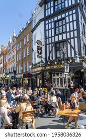 London, UK - 18 April 2021: Outdoor Drinking And Dining Outside Pubs On Old Compton Street, Soho, Central London