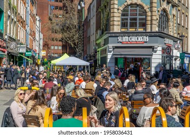 London, UK - 18 April 2021: Outdoor Drinking And Dining Outside Pubs On Old Compton Street, Soho, Central London