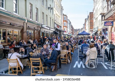 London, UK - 18 April 2021: Outdoor Drinking And Dining Outside Pubs On Old Compton Street, Soho, Central London